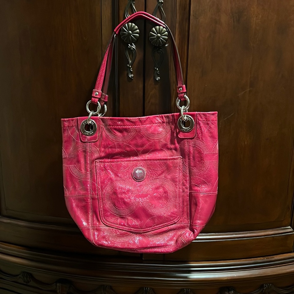 Hot Pink Tote by Coach. Used by in good condition. 12 x 9.5